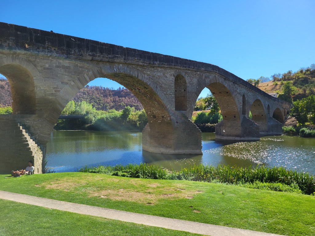 Picturesque Romanic bridges spans a river in Puente La Reina, Navarra, Spain.