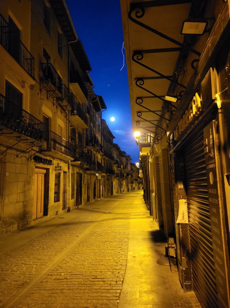 The moon lighting the path out of Puente La Reina in the early morning.