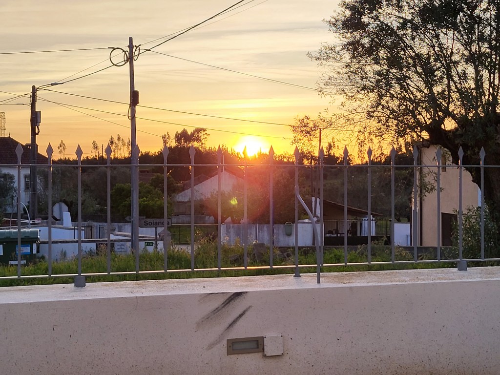 The sun is setting over Calvinos, Portugal.