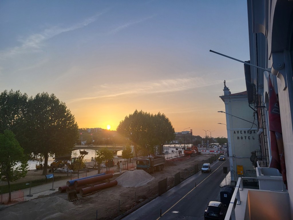 Sunset over the Mondego River in Coimbra, Portugal.