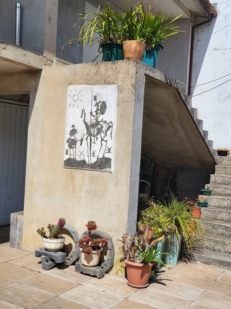 A copy of Picaso's Don Quixote is painted on the wall of a Portuguese home.