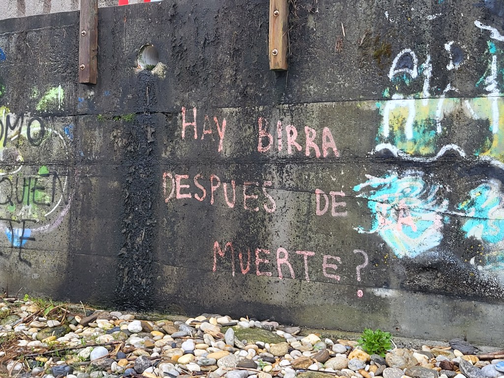 Graffiti asking the important question, Is there beer after death?