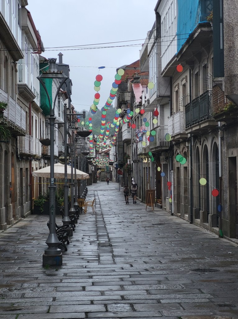 Looking down the stone main street of Caldas de Reis, Spain.