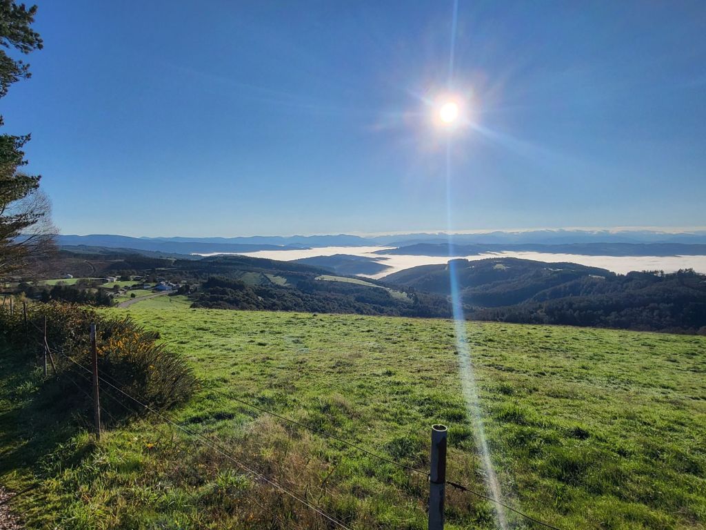 Sunrise in the Galician hills, with a fog settled in the valleys below.