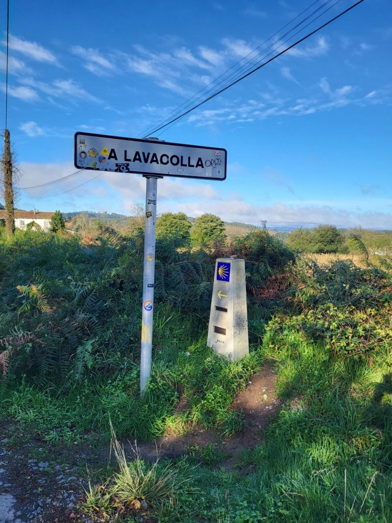 City sign and marker for the Camino de Santiago.