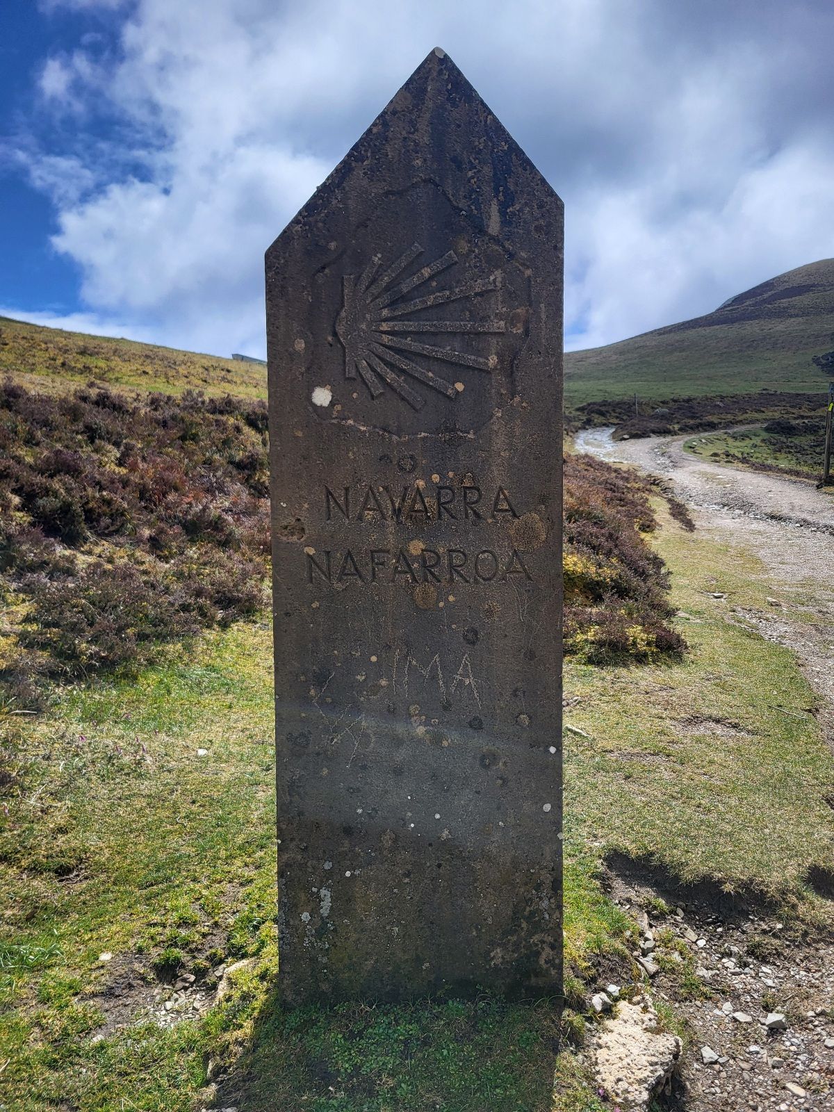 Sign in the Pyrenees mountains marking the border of Navarra (Nafarroa)