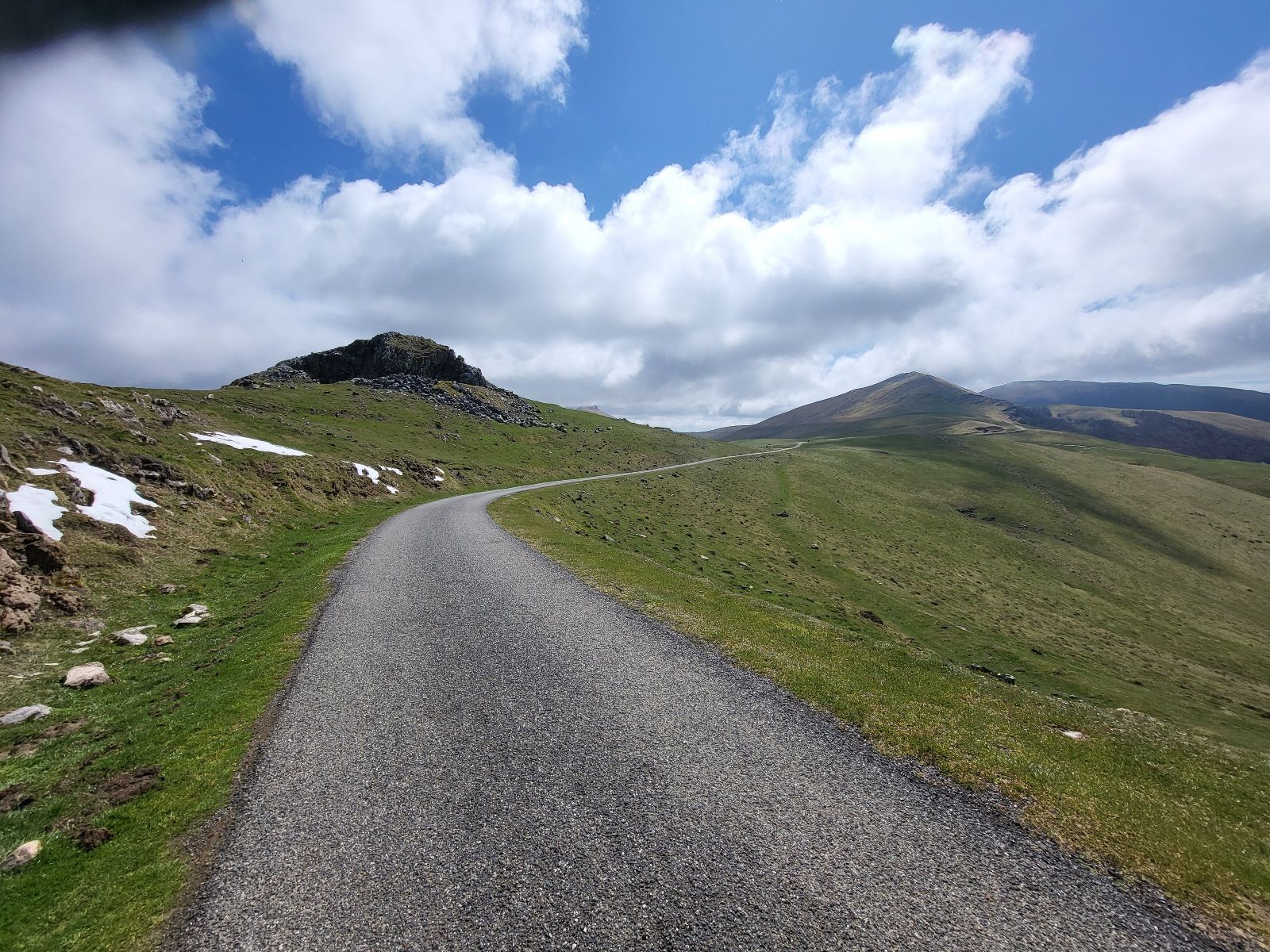 Mountain road in treeless terrain.